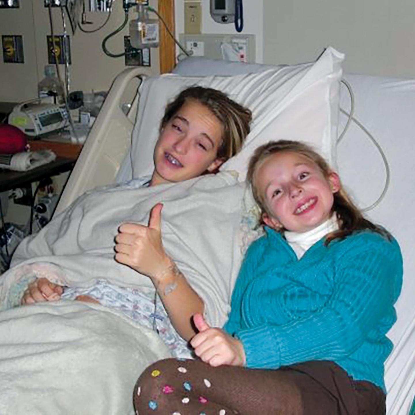 Brit Marien '12 in hospital bed after surgery
