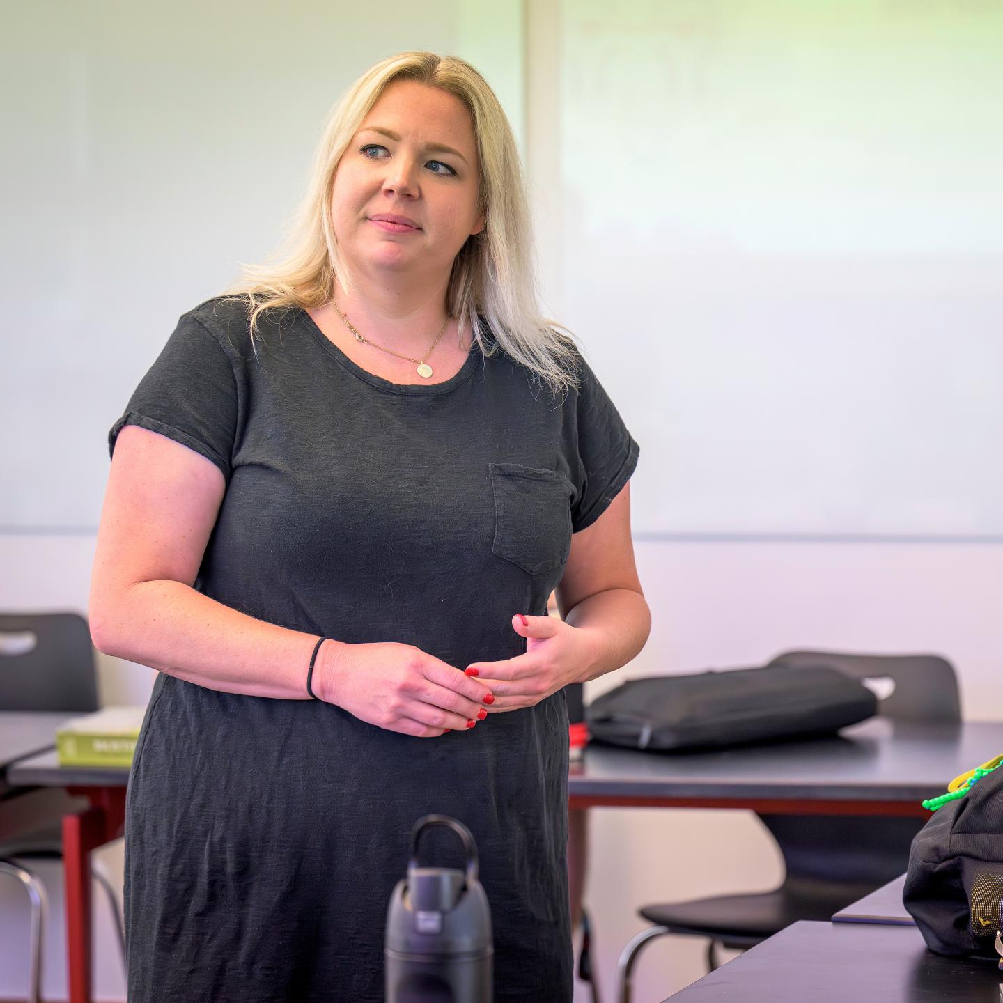 SPS Science Teacher Dr. Allyson “Ally” Bryant in the classroom listens to questions from students in the Advanced Studies Program.
