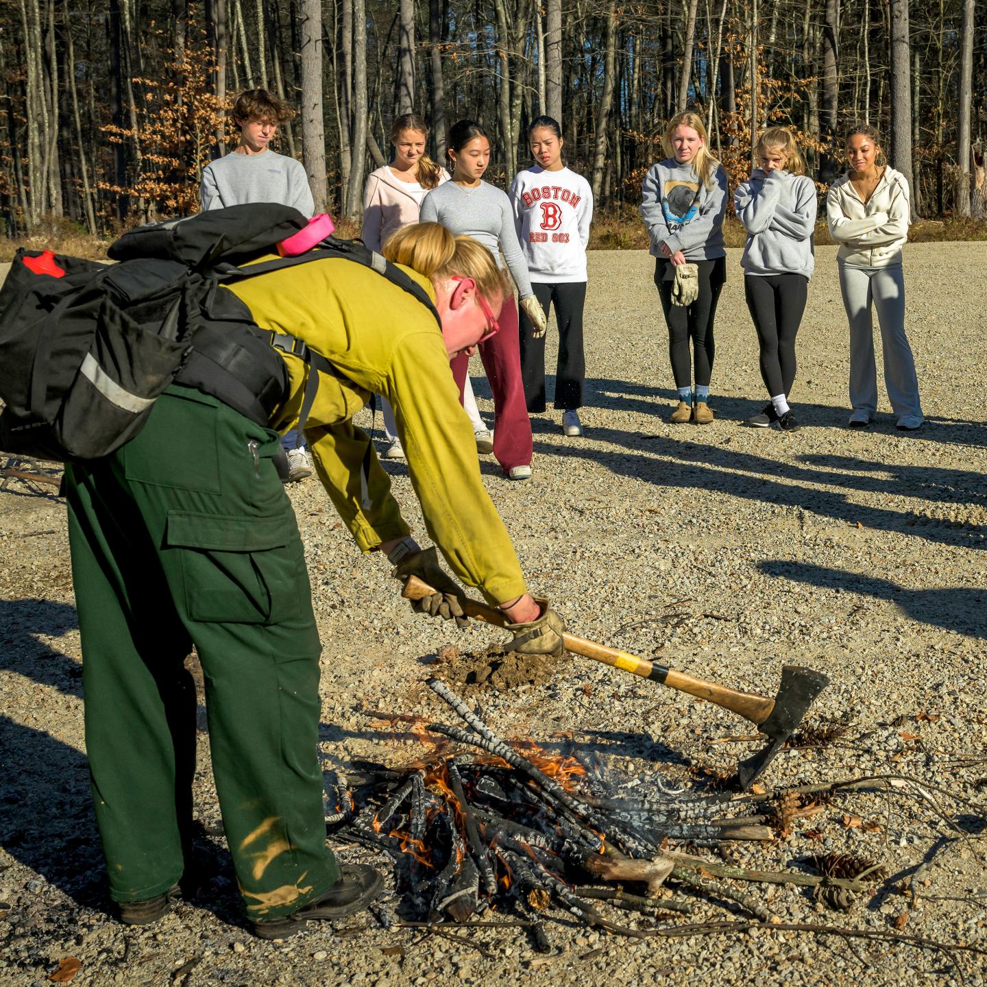Meredith Finch demonstrating fire safety techniques to students