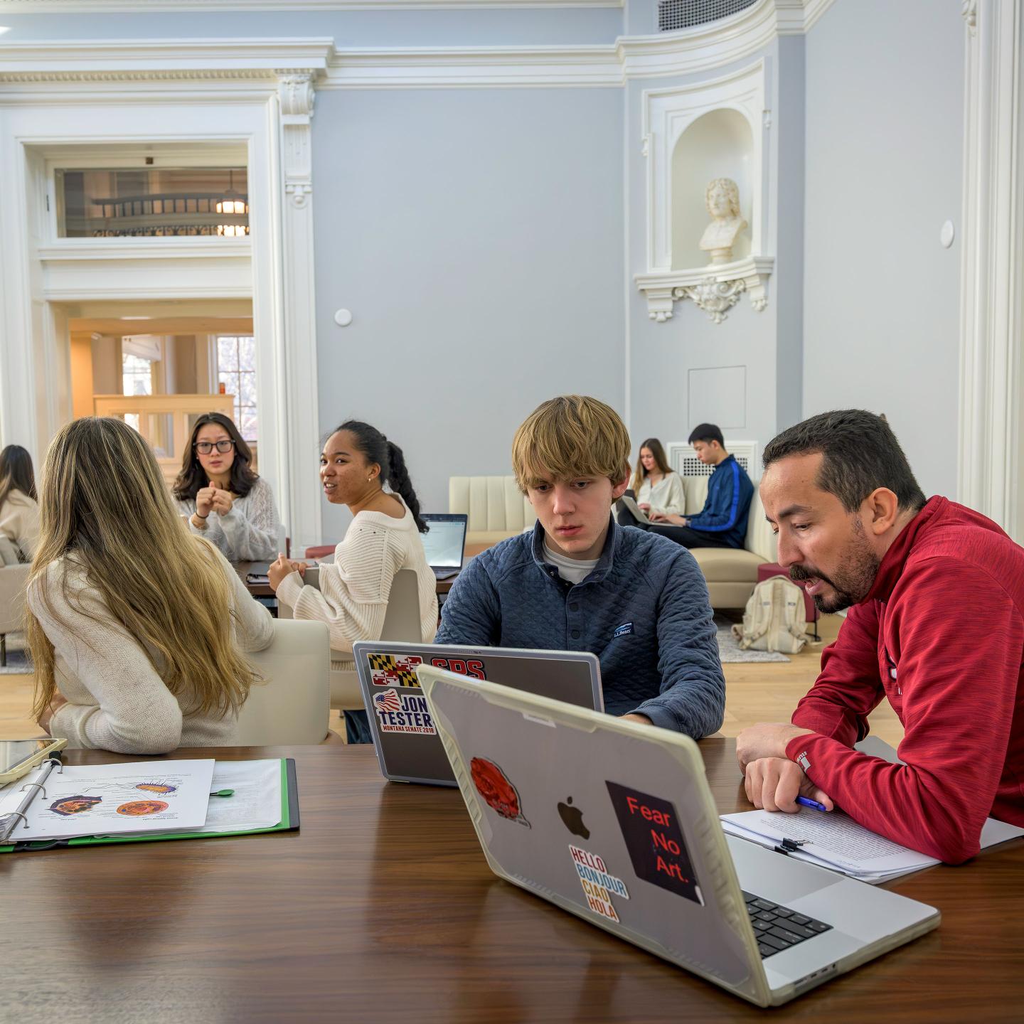 Dr. Baazaoui working with students during a study period in Sheldon