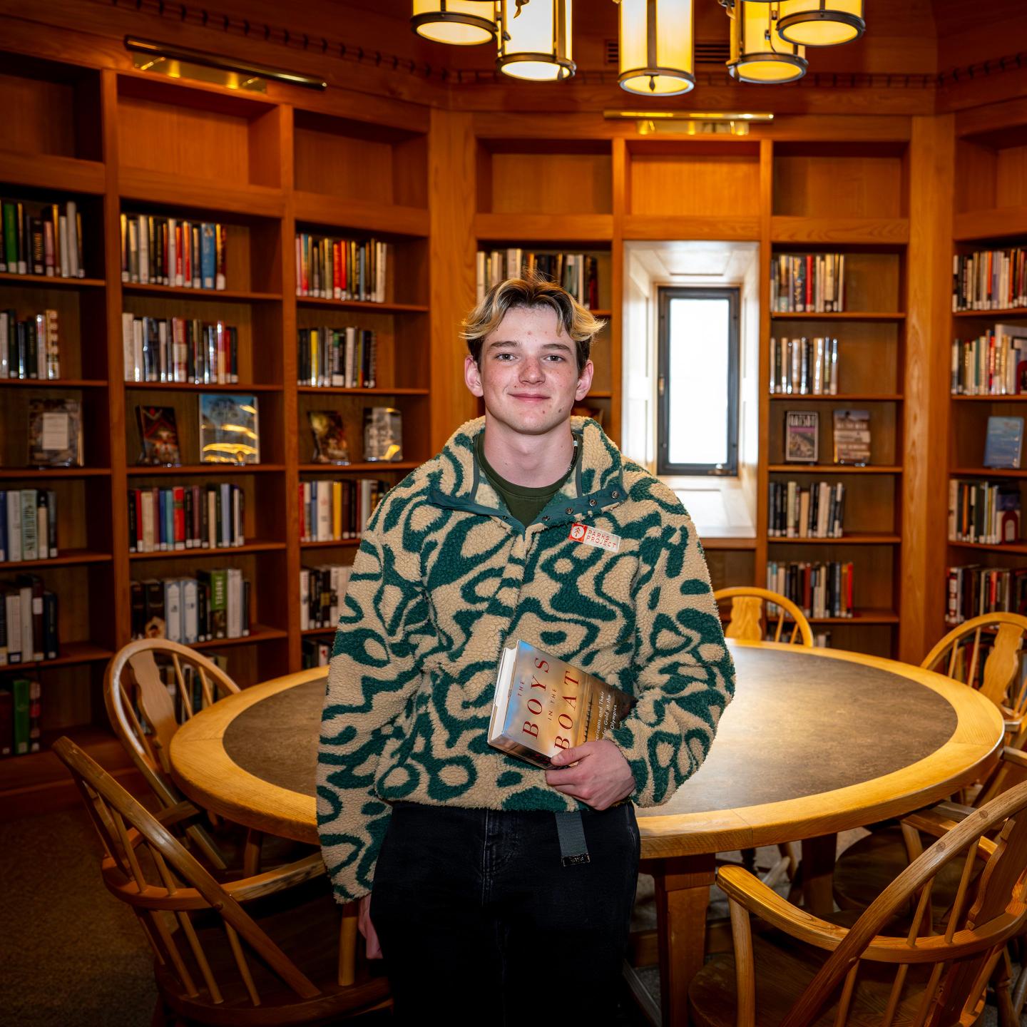 Kyle Gump '26 with his favorite book, Boys in the Boat