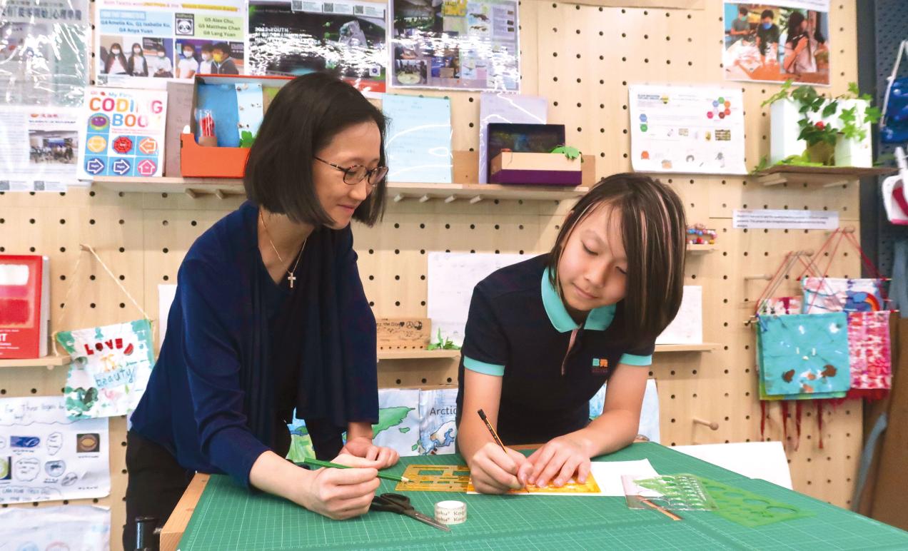 Renée Boey '00 with student at Bloom KKCA Academy