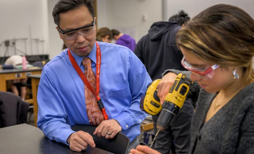 Mark Hermano with student in Physics Class