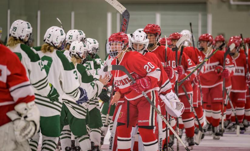 St. Paul's School Girls Varsity Hockey shake hands with opponents after a win. 