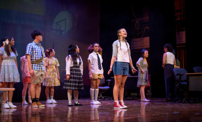 Students on-stage during the performance of "The 25th Annual Putnam County Spelling Bee"