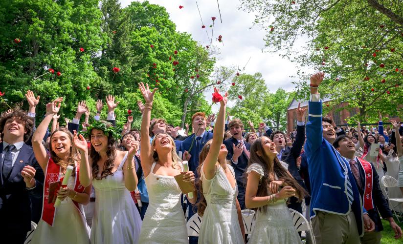 Graduates throw roses at the end of the Graduation Ceremony for the Form of 2025