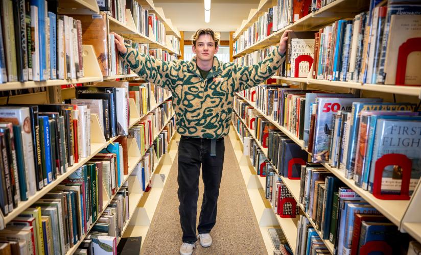 Kyle Gump '26 among the stacks in Ohrstrom Library