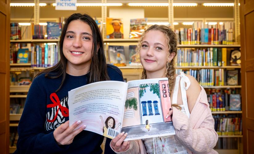 Sofia Recchi and Caroline Anttila holding their book