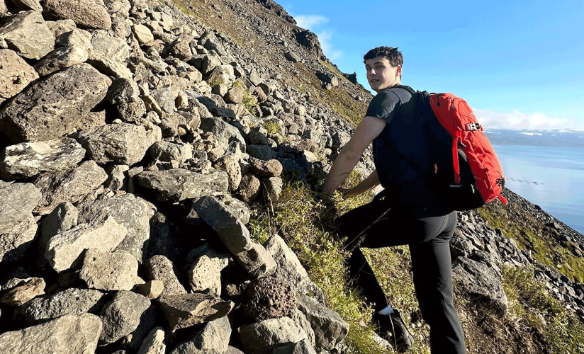 Kyle Pellerin hiking up a fjord in Isafjordur, Iceland