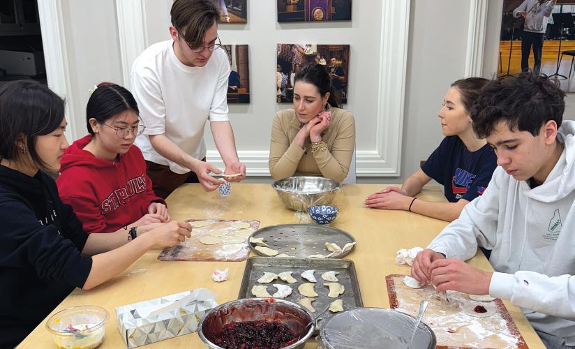 Ukranian Club members teaching students to make varenyky