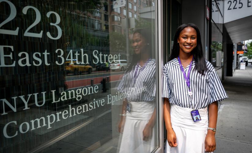 Motunrayo Odukoya ’27 stands outside the NYU Langone Comprehensive Epilepsy Center.