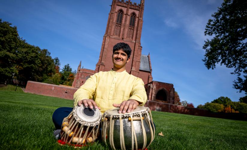 Tejas Karthik playing the tabla on the Chapel Lawn