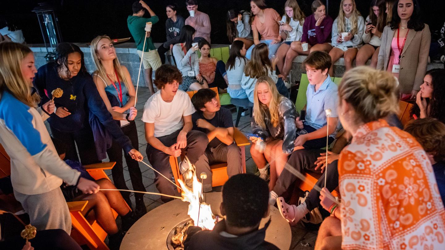 students roasting marshmallows