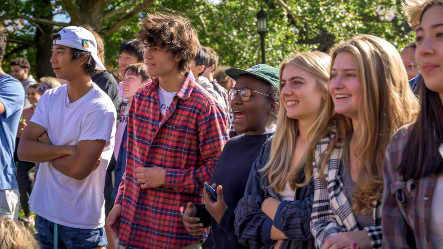 Students standing together outside. 