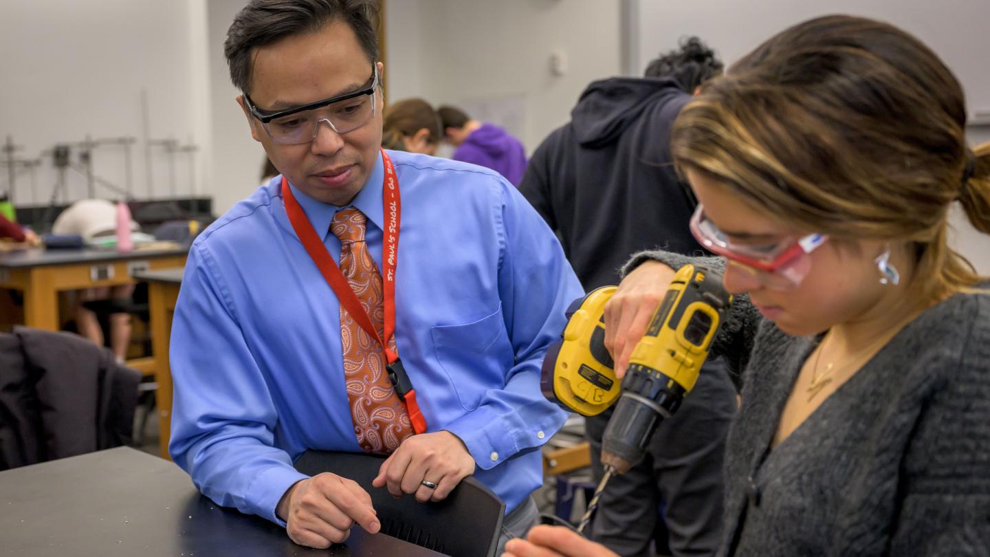 Mark Hermano with student in Physics Class