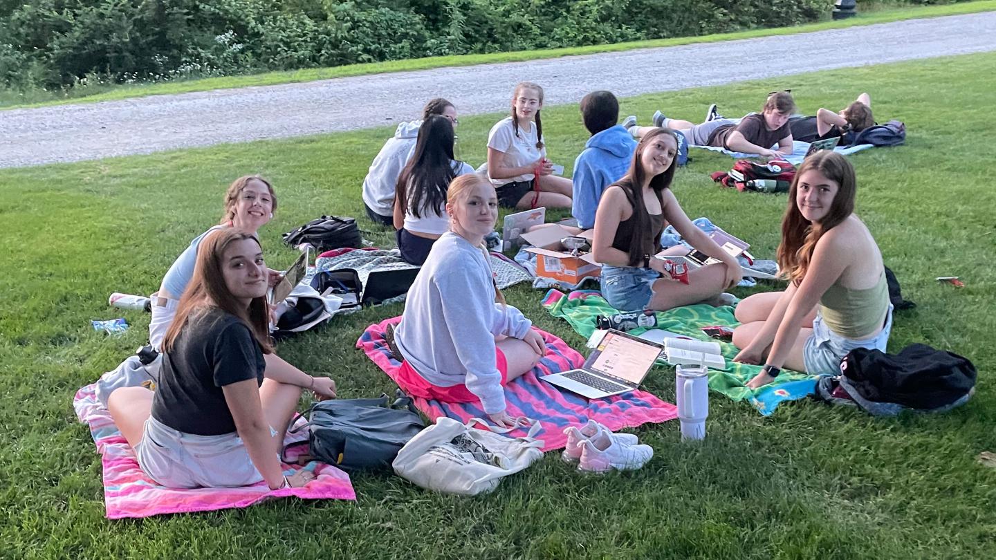 ASP students 2023 studying on Ohrstrom Library lawn