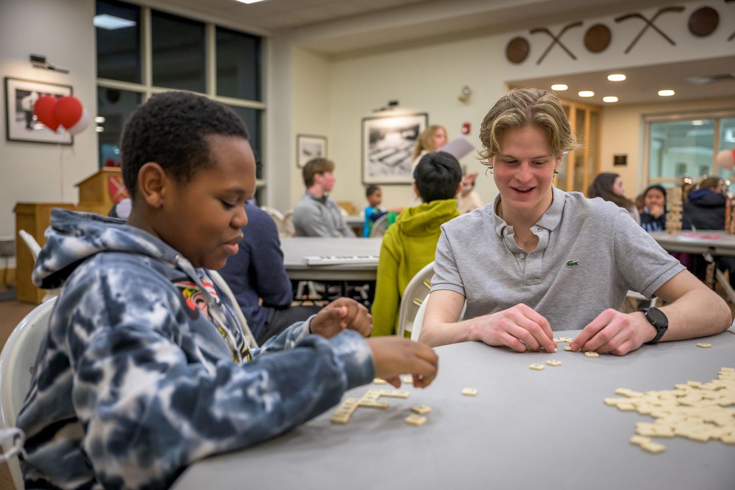 Playing dominoes with Friends Program mentee