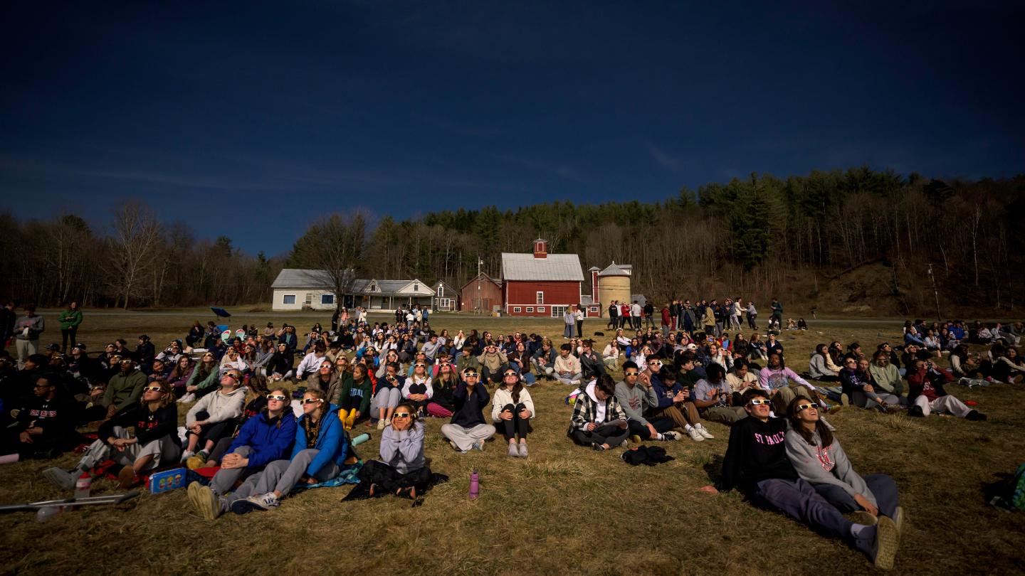 Students experiencing solar eclipse at Foote Brook Farm