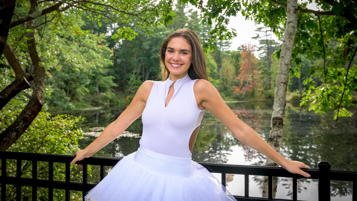 Lulu Mangriotis '25 in ballet outfit in front of Sheldon Pond