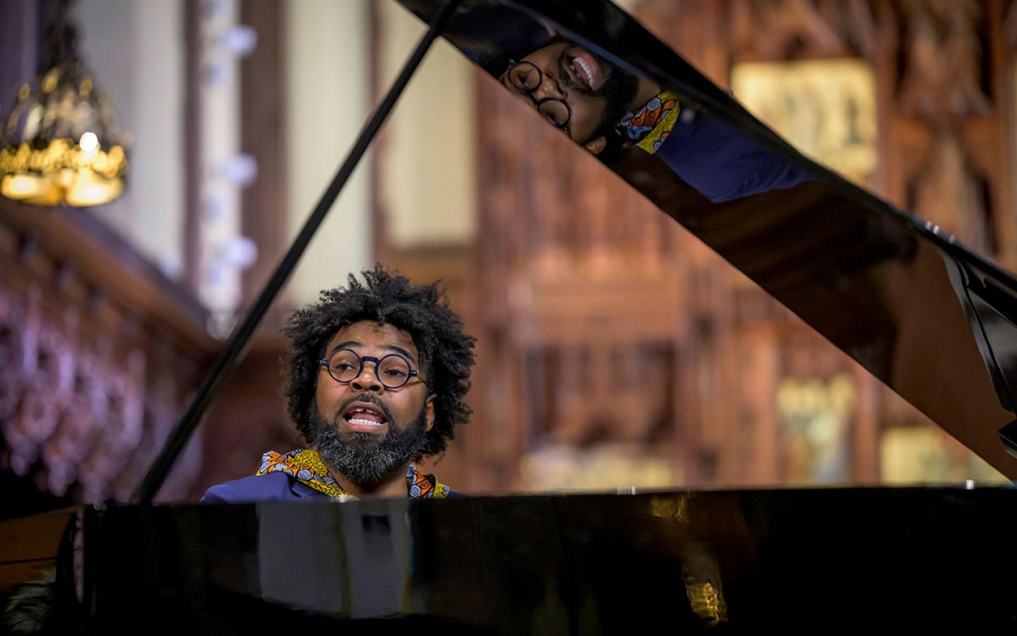 Visitor Justin Merrick performs during chapel.