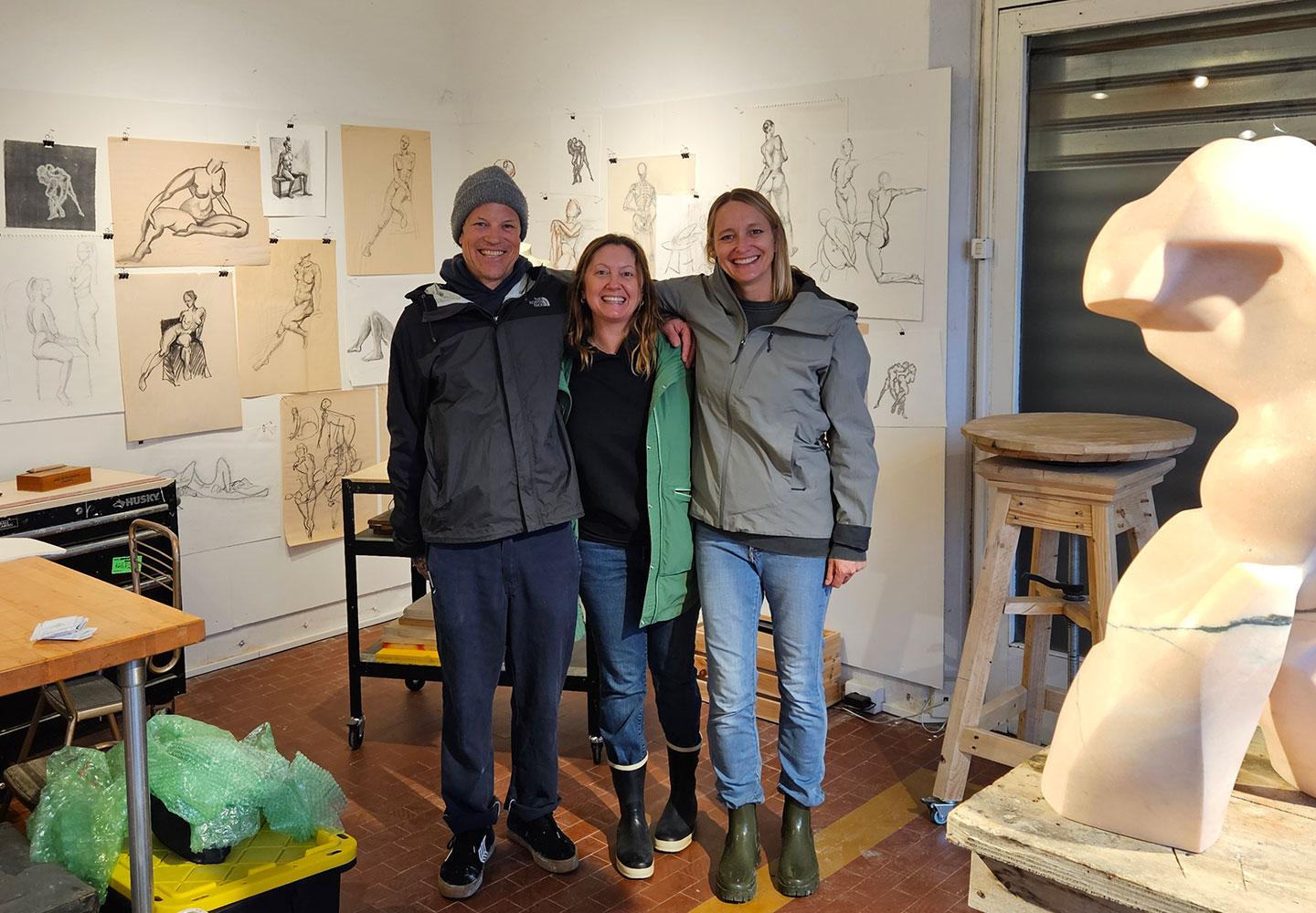 Becky and Nanda with a local artist in Portugal