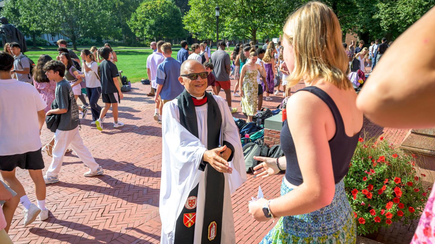 SPS Dean of Chapel and Spiritual Life Rev. Charles Wynder Jr greets students as they exit morning chapel after Fall Convocation.