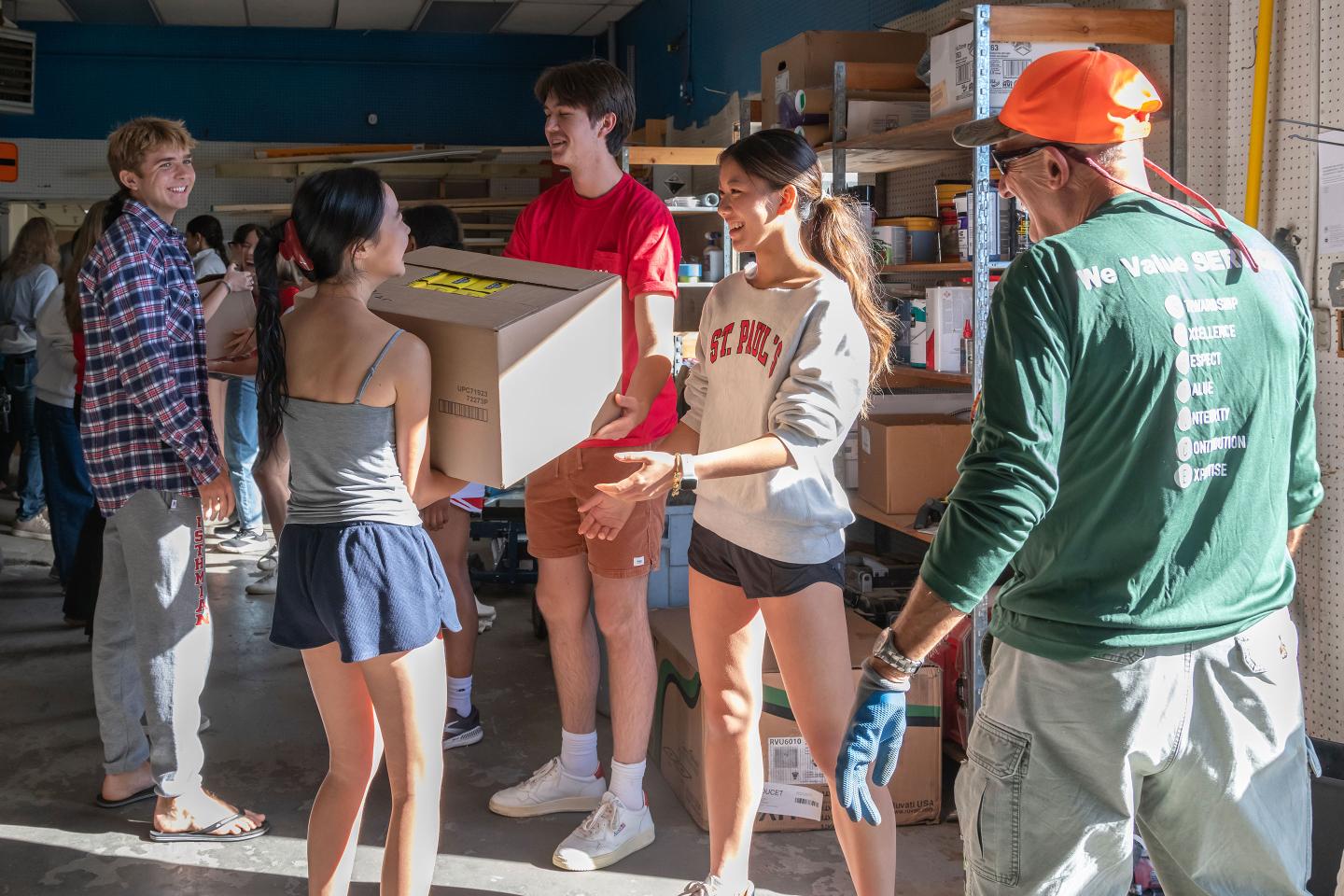 Bucket brigade to load trucks from the food pantry's warehouse