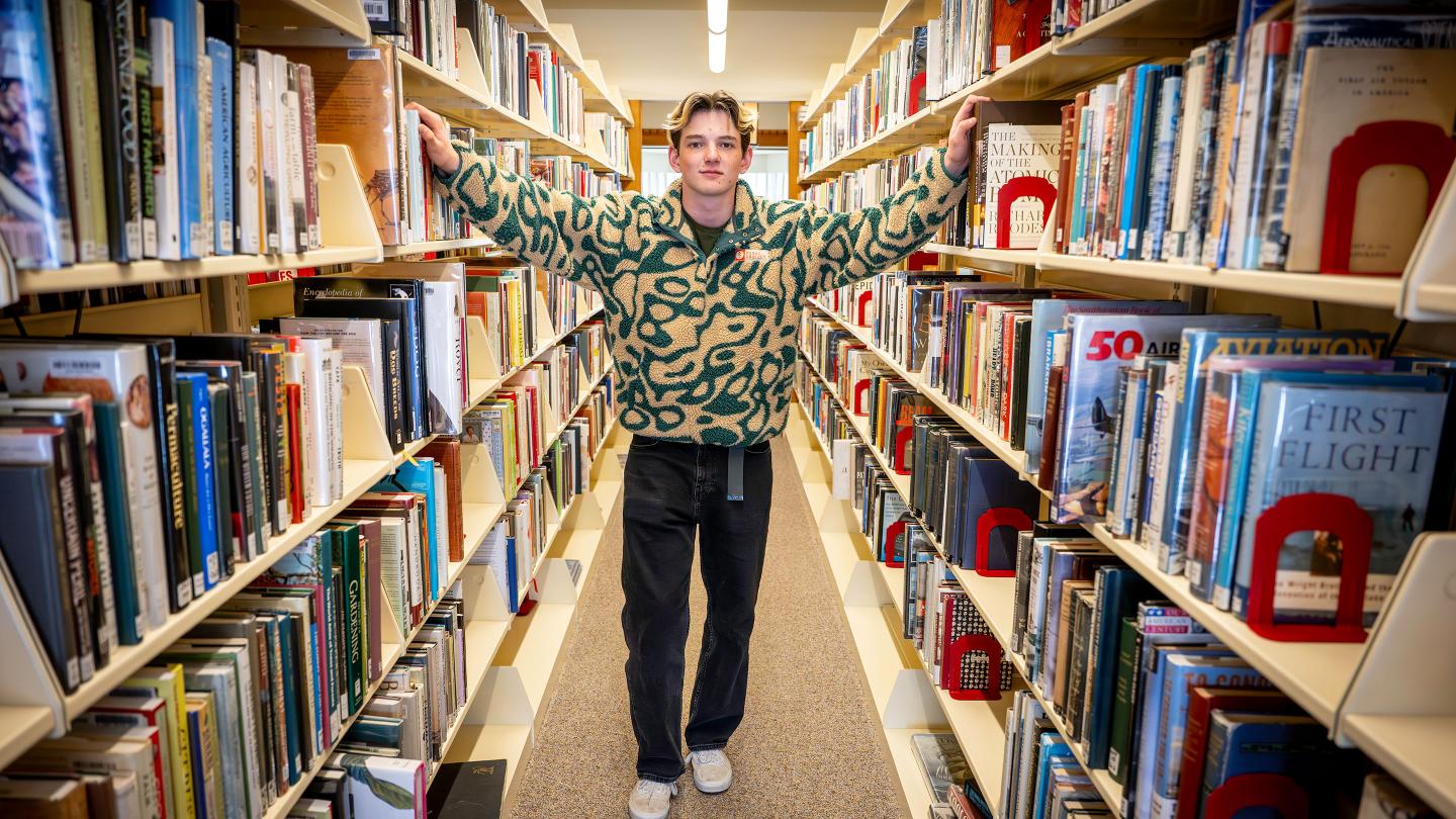 Kyle Gump '26 among the stacks in Ohrstrom Library