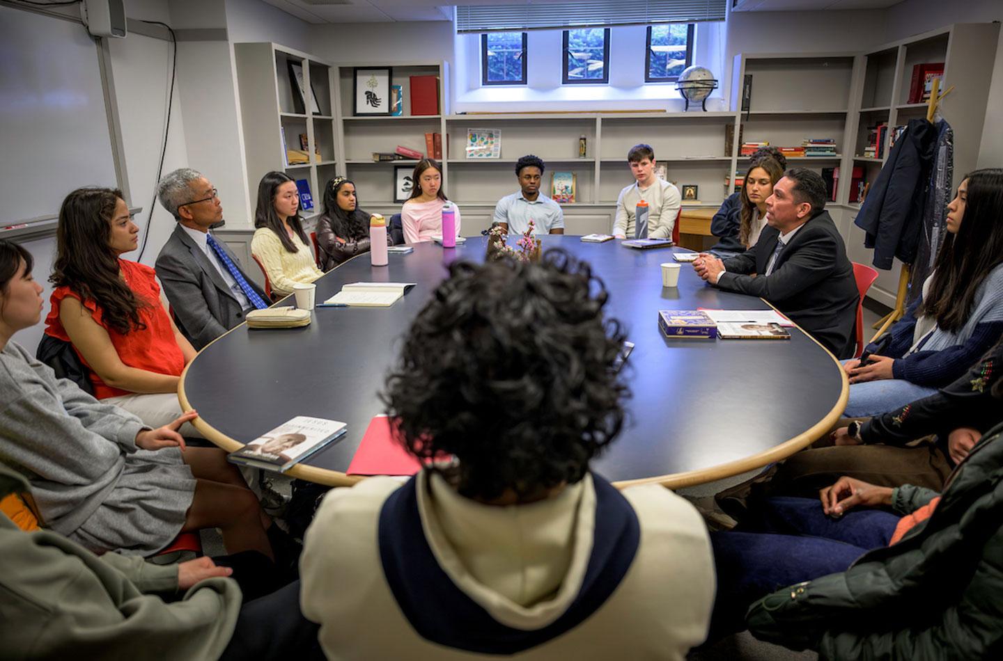 Bruce Chan and Christian Valdes in class with students