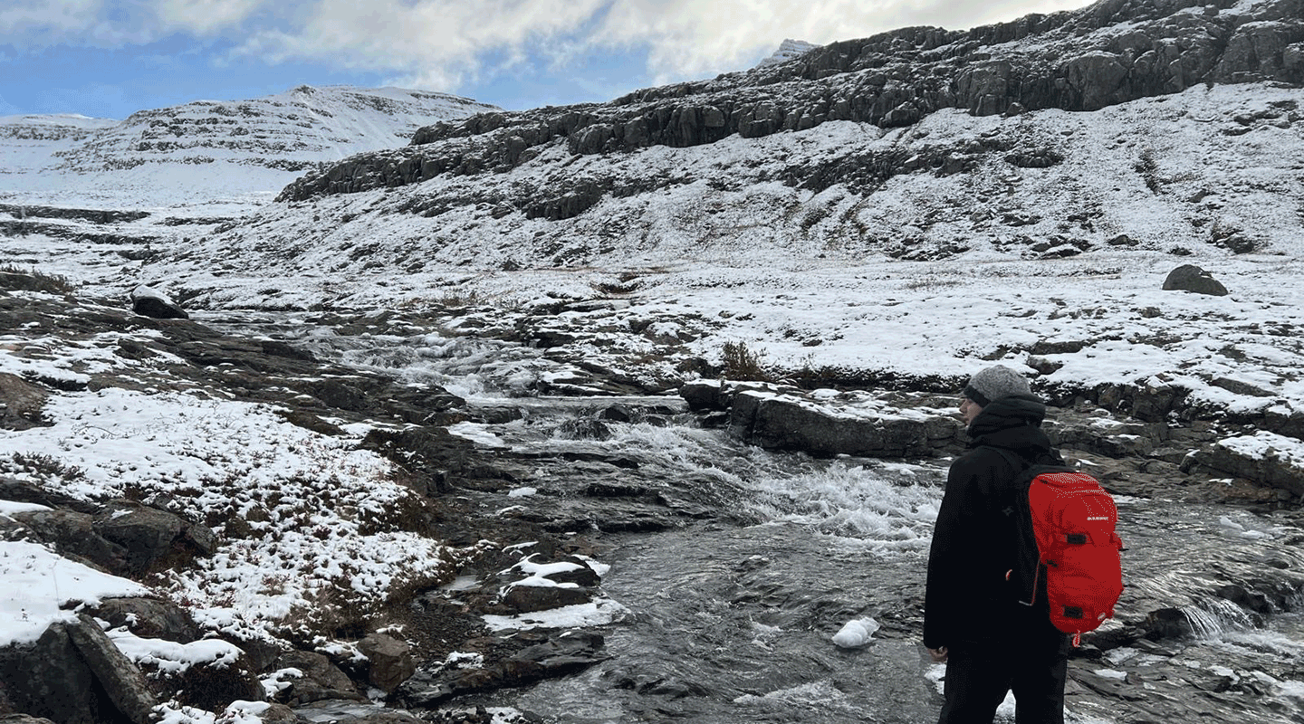 Kyle Pellerin surveying a remote stream in Iceland