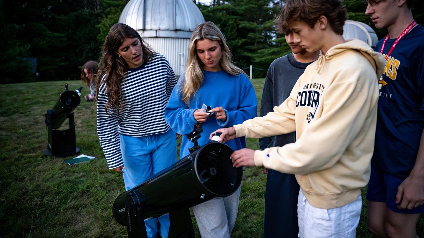 Students in the Advanced Studies Program's Astronomy Major Course assemble a telescope.