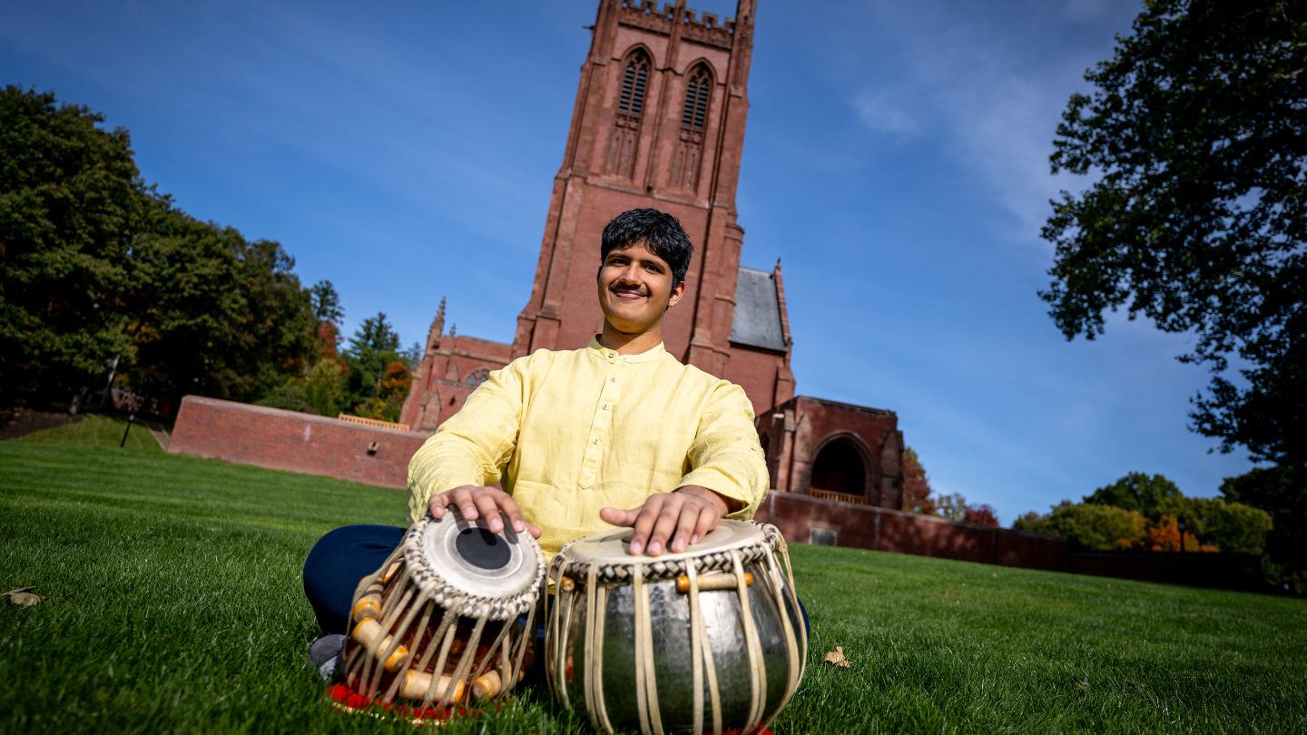 Tejas Karthik playing the tabla on the Chapel Lawn